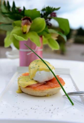 a breakfast sandwich with an egg on a plate at Barnabrow Country House in Killinagh