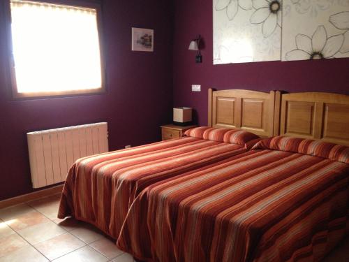 Ένα ή περισσότερα κρεβάτια σε δωμάτιο στο Hosteria San Emeterio