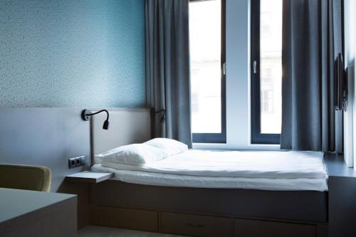 En eller flere senge i et værelse på Comfort Hotel Xpress Central Station