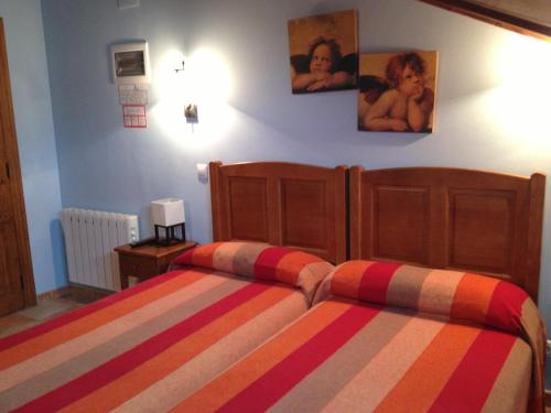 Ένα ή περισσότερα κρεβάτια σε δωμάτιο στο Hosteria San Emeterio