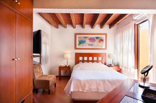 Cama o camas de una habitación en Villas Casa Divina At San Felipe Church Area