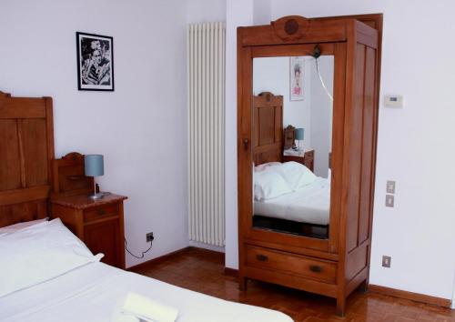 Кровать или кровати в номере Guest House Ca' Lou al Teatro
