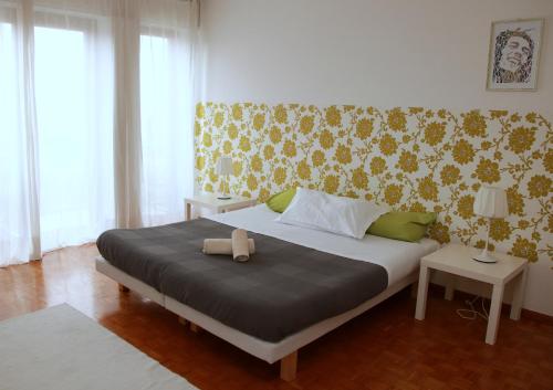 Кровать или кровати в номере Guest House Ca' Lou al Teatro