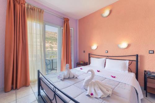 Postel nebo postele na pokoji v ubytování Evelin hotel