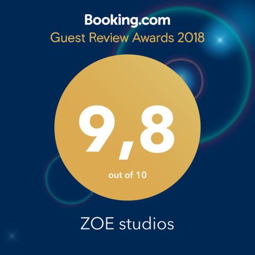 a yellow circle with the words guest review awards on it at Ζoe Studios in Kýthira