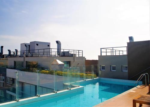 a swimming pool on the roof of a building at GL Apts, rent Upper Pardo Miraflores - Suite 1 Hab in Lima
