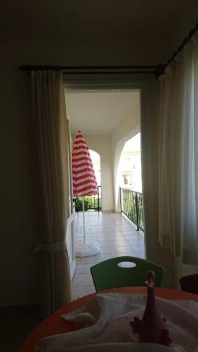 a bedroom with a bed and a view of a balcony at Sunrise Beach Club (Hera B6@) in Kalecik