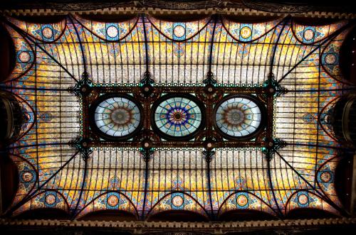 two clocks on the ceiling of a building at Gran Hotel Ciudad de México Zócalo View in Mexico City