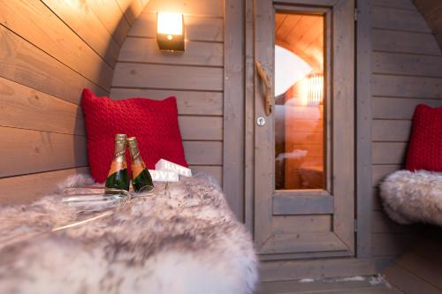 a room with two bottles of champagne on a table at Art-Apartments Kartnaller superior in Neustift im Stubaital