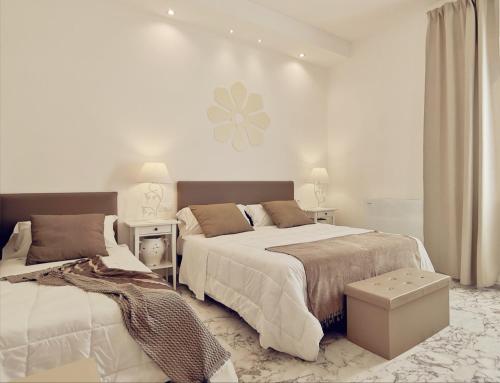 Кровать или кровати в номере FLOS Guest House