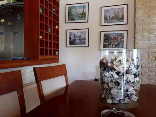 a vase filled with stuffed animals sitting on a table at Villa Thanos in Marathias