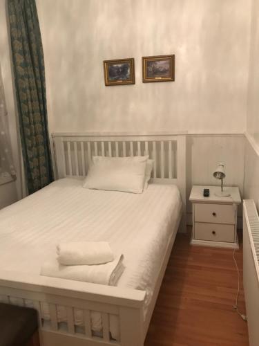 Ένα ή περισσότερα κρεβάτια σε δωμάτιο στο Manor Lodge Guesthouse