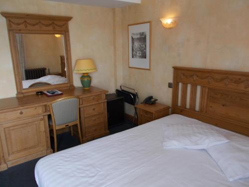 Postel nebo postele na pokoji v ubytování Hotel Manitoba