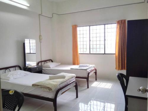 Katil atau katil-katil dalam bilik di Desair Apartment By SCHT