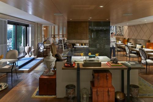 a large room with a kitchen and a living room at Mandarin Oriental, Taipei in Taipei