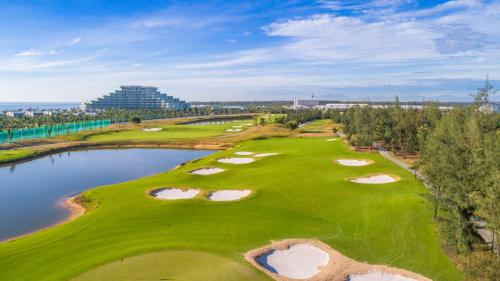 an aerial view of the golf course at the resort at Vinpearl Resort & Golf Nam Hoi An in Hoi An