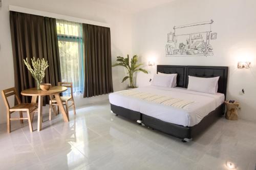 Postel nebo postele na pokoji v ubytování Sanur House