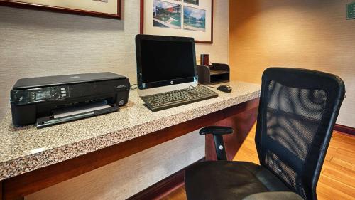 a desk with a laptop computer and a printer at Best Western of Wise in Wise