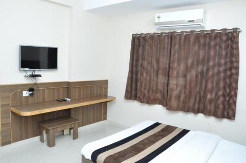 Postel nebo postele na pokoji v ubytování Hotel Nandnandan