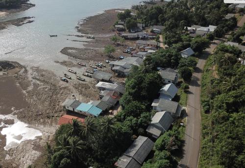 an aerial view of a village next to the ocean at HEAVEN HILL LANTA in Ko Lanta