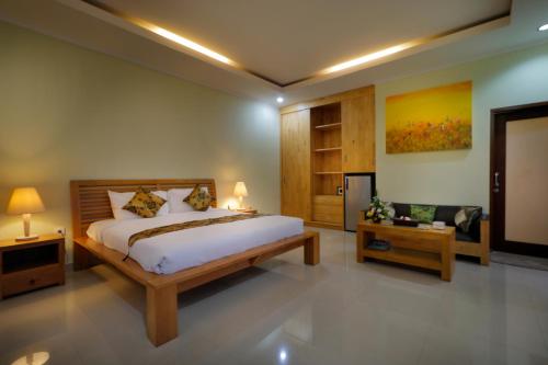 Voodi või voodid majutusasutuse Kori Bali Villa Seminyak toas
