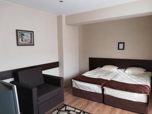 Postel nebo postele na pokoji v ubytování Heat Complex Family Hotel