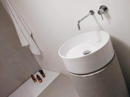 a bathroom with a white sink and a shower at Soardi Accommodation for business & funny in Rimini