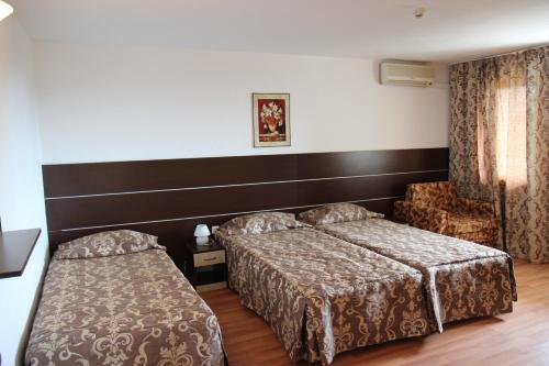Postel nebo postele na pokoji v ubytování Hotel Zora