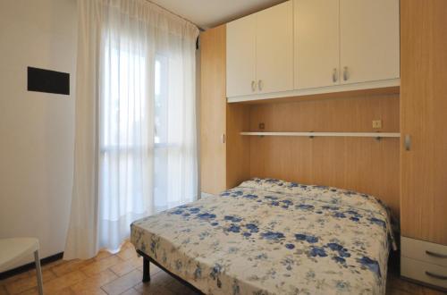 Een bed of bedden in een kamer bij Condominio Pleione