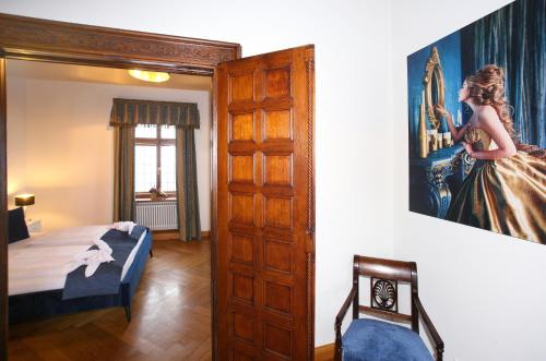 Postel nebo postele na pokoji v ubytování Schlossresidenz Fischhorn