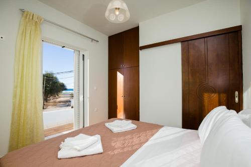 Postel nebo postele na pokoji v ubytování Sea Side House Rapanas