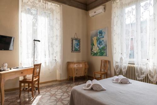 Postel nebo postele na pokoji v ubytování BB La Bella Addormentata e il Principe Calaf