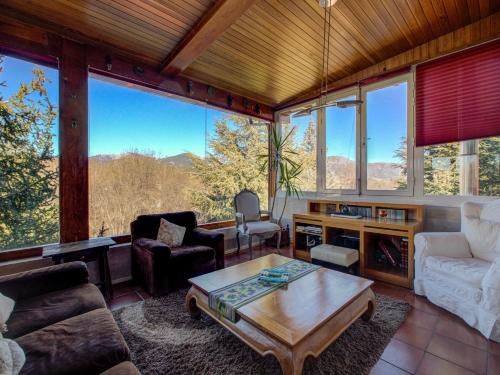 a living room filled with furniture and a large window at B&B Concha in Becerril de la Sierra