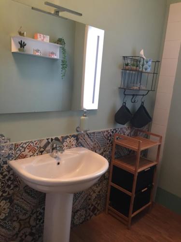 a bathroom with a sink and a mirror at B&B Villa al Parco in Sala Baganza