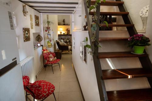 a room with a staircase and a living room at B&B L'Orologio in Signa