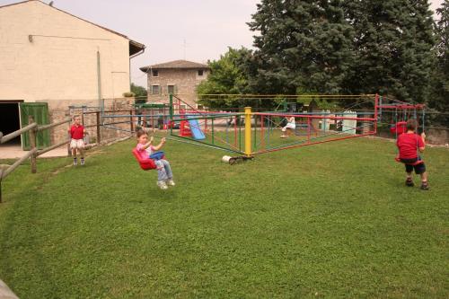 a group of children playing in a playground at Agriturismo La Staffa in Valeggio sul Mincio