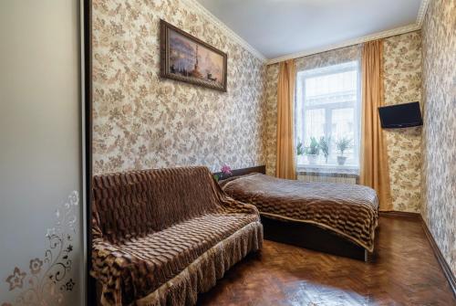 Кровать или кровати в номере Apartamenty Polytehnichna str.