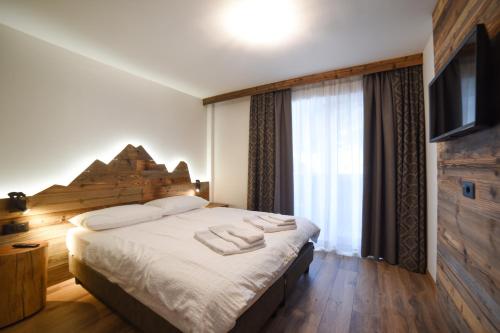 Katil atau katil-katil dalam bilik di Residence & Wellness 3MILA
