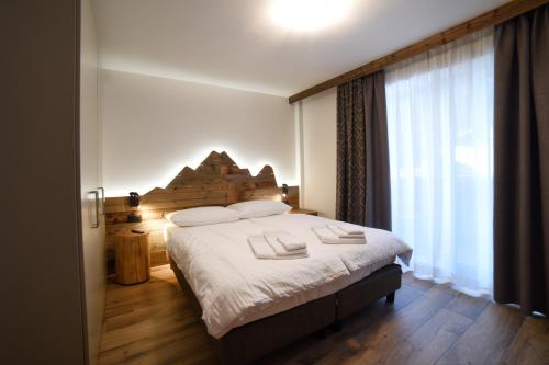 Katil atau katil-katil dalam bilik di Residence & Wellness 3MILA