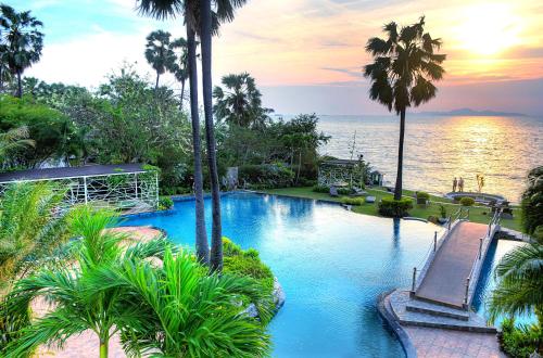 a swimming pool with a view of the ocean at Lux SL Luxury Style of Life 5 in North Pattaya