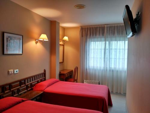 מיטה או מיטות בחדר ב-Hotel Xeito