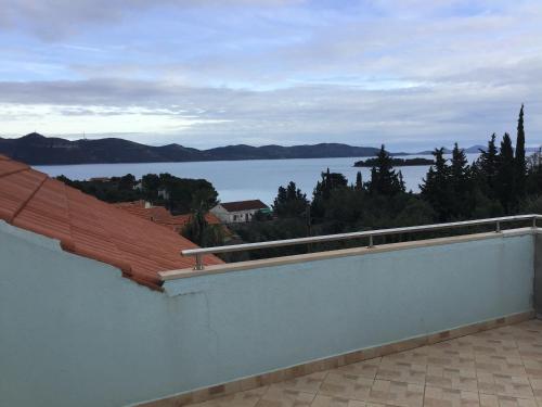 a view of a body of water from a roof at Apartman Carina in Veli Iž