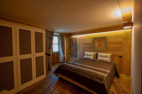 Säng eller sängar i ett rum på Casa Vacanze Petit Haury - Alloggi ad uso turistico vda Arvier n 0039 e n 0040 -