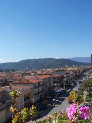 a view of a city with buildings and flowers at Le Stanze di Patika in Tortolì
