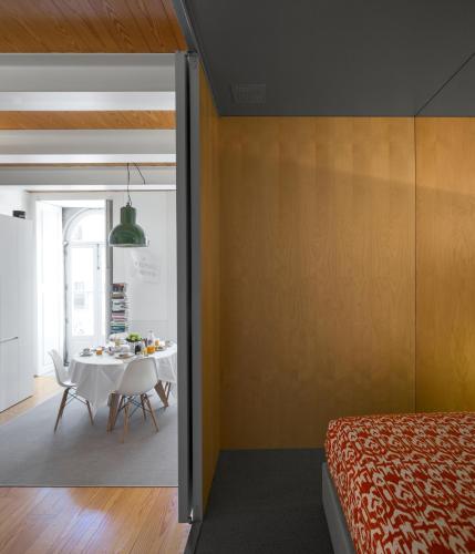 a bedroom with a table and a dining room at Flattered to be in Porto in Porto