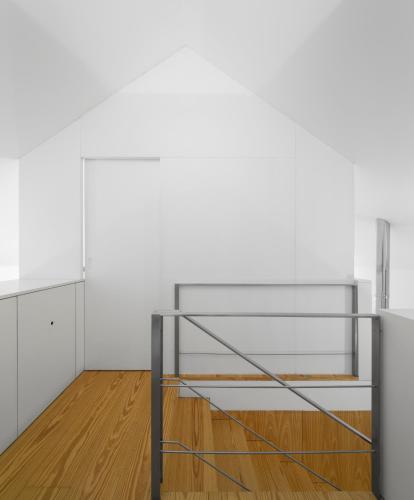 a metal shelf in a room with a wooden floor at Flattered to be in Porto in Porto