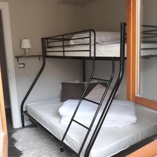 a couple of bunk beds in a room at Felix in Giustino
