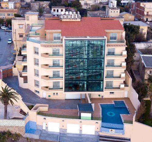 an aerial view of a building with a swimming pool at RESIDENCE TOURISTIQUE DU PORT in Alger