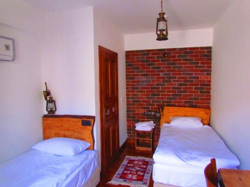 Katil atau katil-katil dalam bilik di Amazon Petite Palace