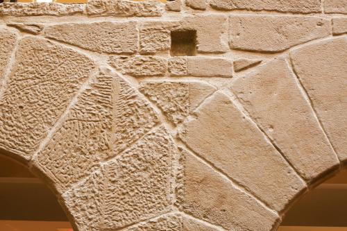 a close up of a stone wall at F&G Logroño in Logroño